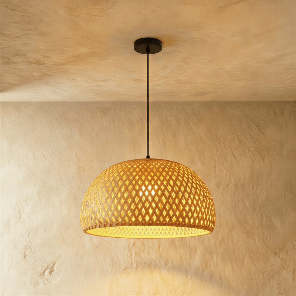 Clérachic large woven dome pendant light with an open diamond weave and a warm glow on the ceiling plaster.