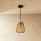 Clérachic slatted teardrop pendant light switched off, natural wood-toned strips and an exposed filament bulb inside.