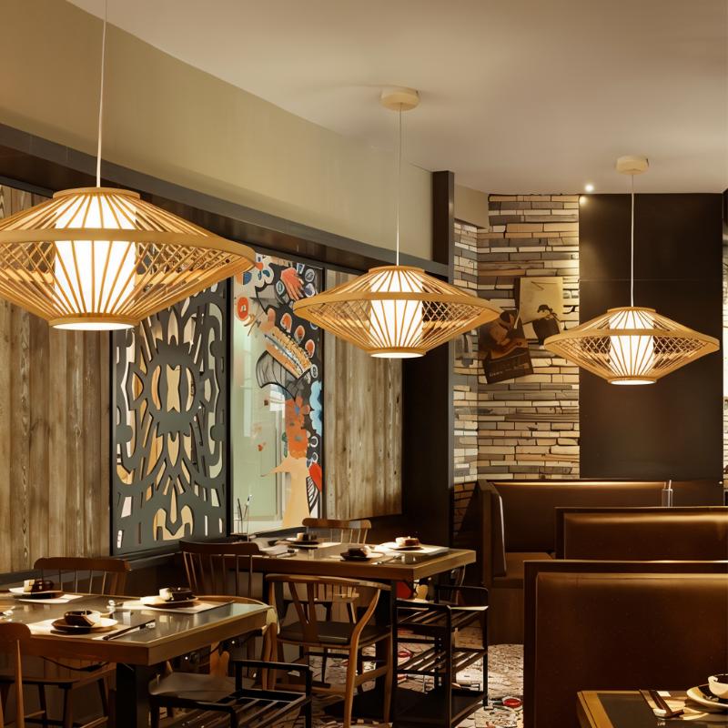 Clérachic flared slatted pendant lights hanging in a restaurant above wooden tables, lit warm against dark panelling.
