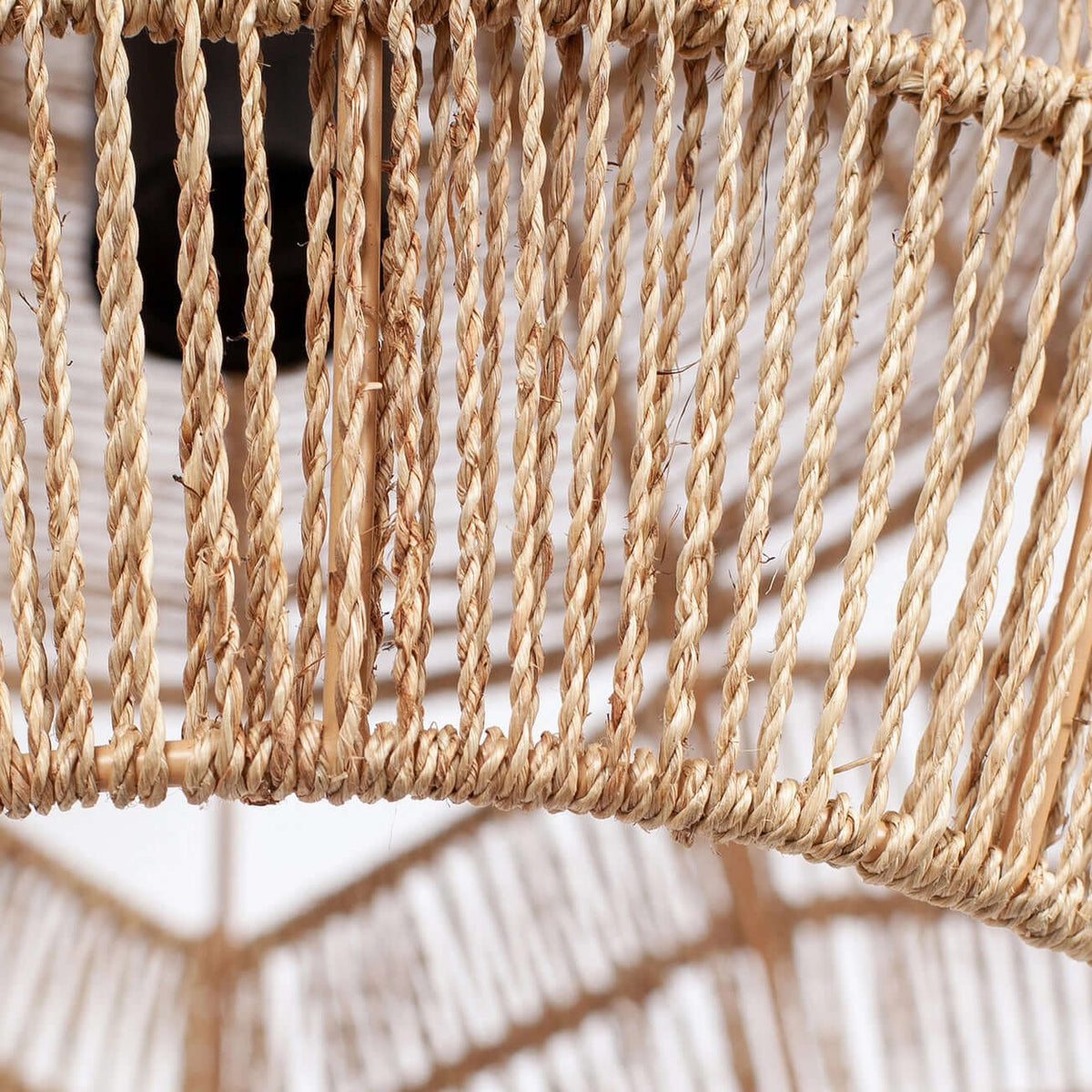 Close view of the twisted natural rope strands around the lower rim of this Clérachic pendant.