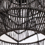 Close view of the twisted black rope weave and the lower rim of this Clérachic pendant.