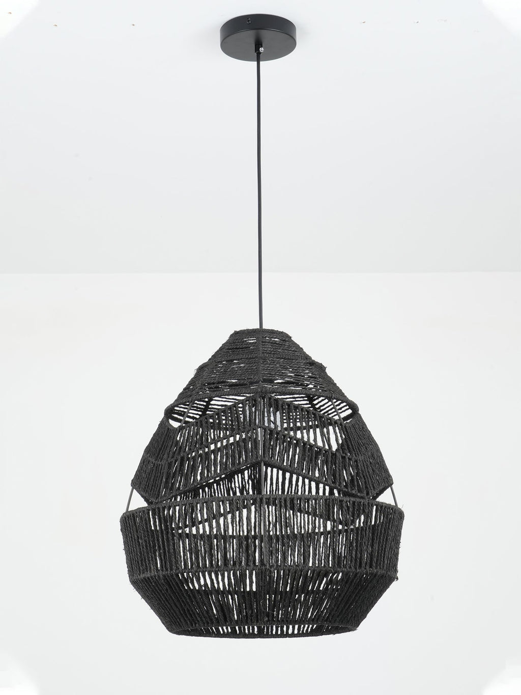 Black Clérachic pendant on a slim black cord, showing the stepped rope bands of the shade from a low angle.