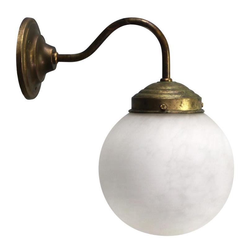 Clérachic alabaster sphere and aged brass bracket photographed from the side, showing the curve of the swan neck.
