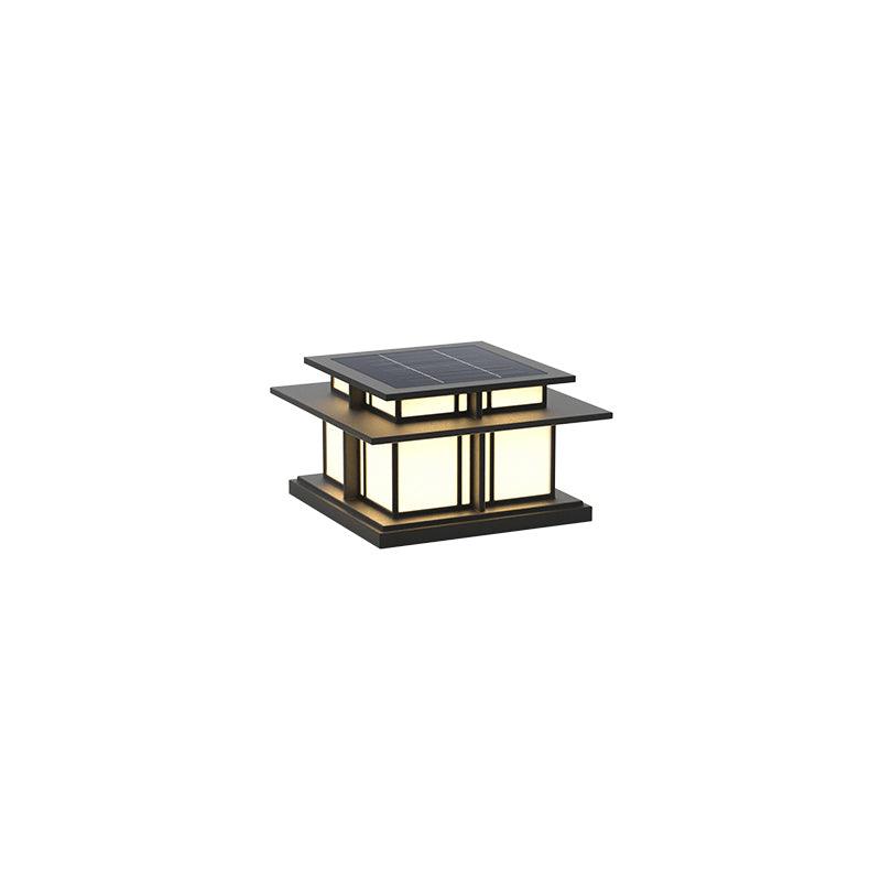 Clérachic Ray pillar light on white, square solar cap over a frosted lantern in black metal.