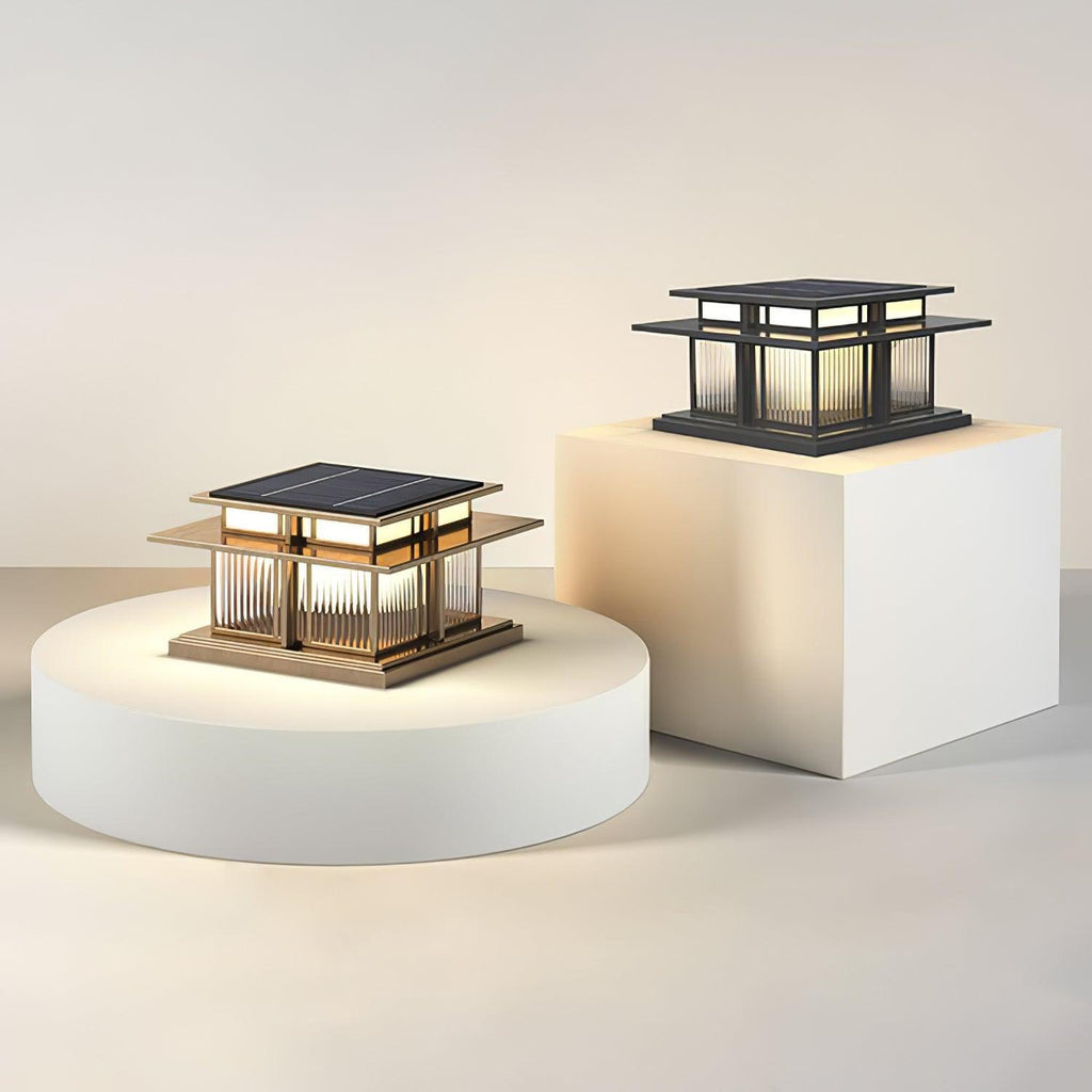 Clérachic Ray pillar lights displayed on pale plinths, one frosted and one ribbed.