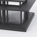 Close view of the Clérachic Ray lantern corner, fluted glass rods behind the black frame.