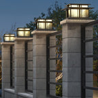 Clérachic Ray pillar lights lining a stone wall at night, each lantern evenly lit.