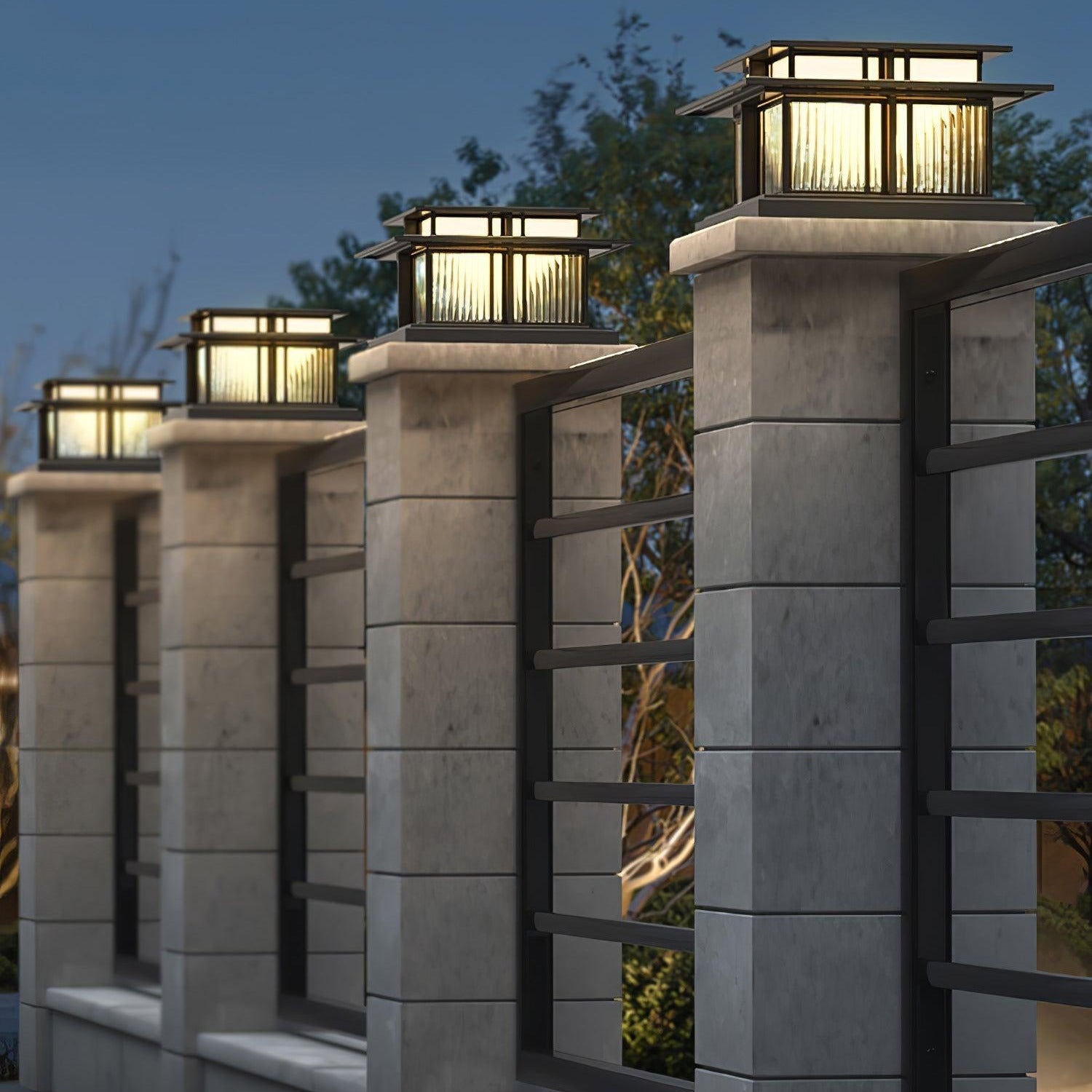 Clérachic Ray pillar lights lining a stone wall at night, each lantern evenly lit.