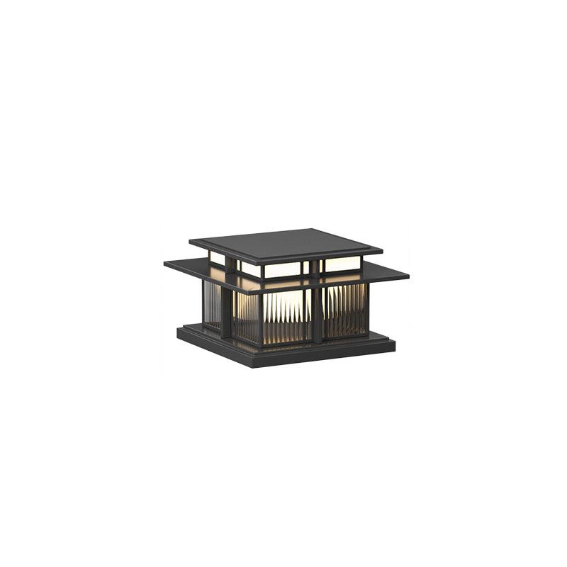 Clérachic Ray pillar light in ribbed glass, small on white with the solar roof in view.