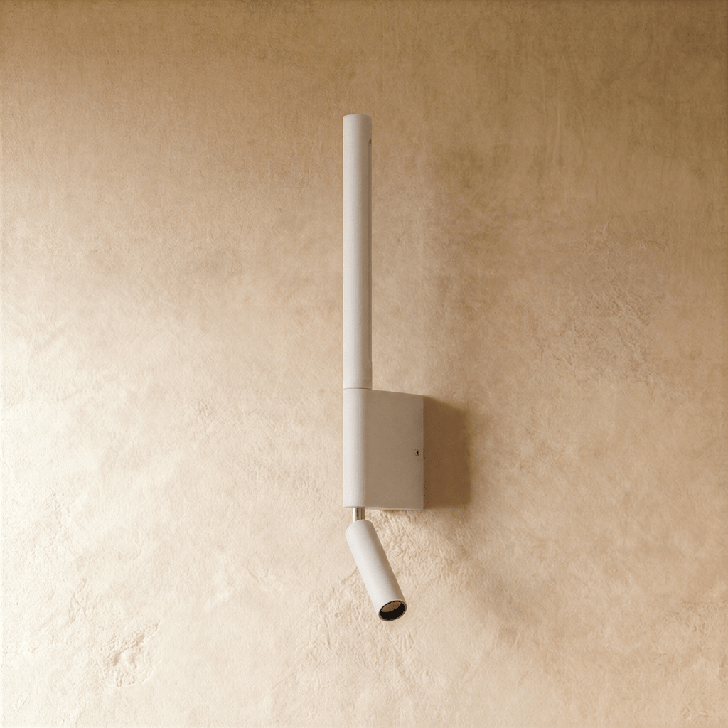 Clérachic slim white wall light, unlit, with a tall round tube, a square wall plate and a small angled reading spot below.