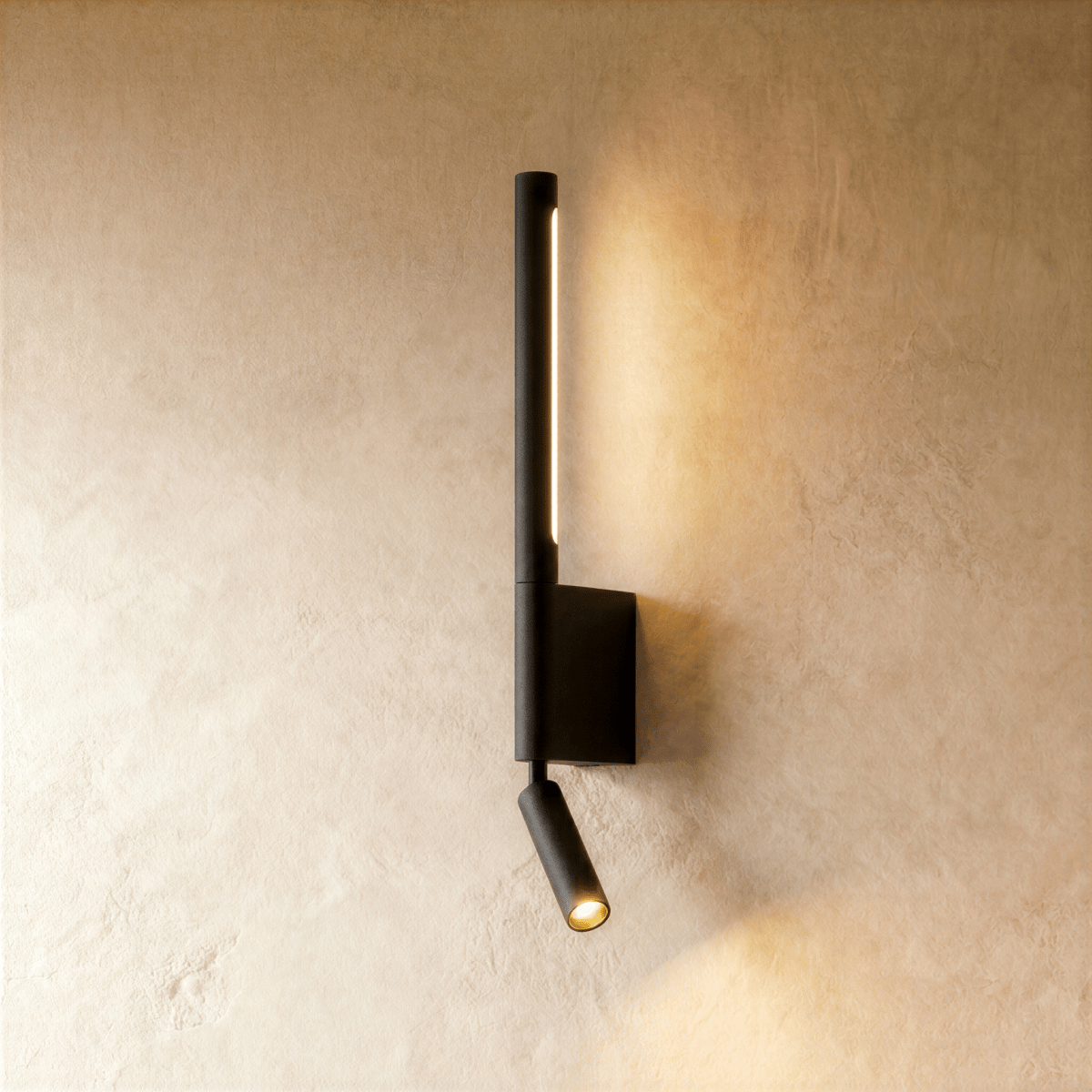 Clérachic slim black wall light with a lit vertical LED strip and a small angled reading spot on a plaster wall.