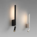 Clérachic slim black and white wall lights side by side on a grey wall, each with a vertical glow and a small reading spot.