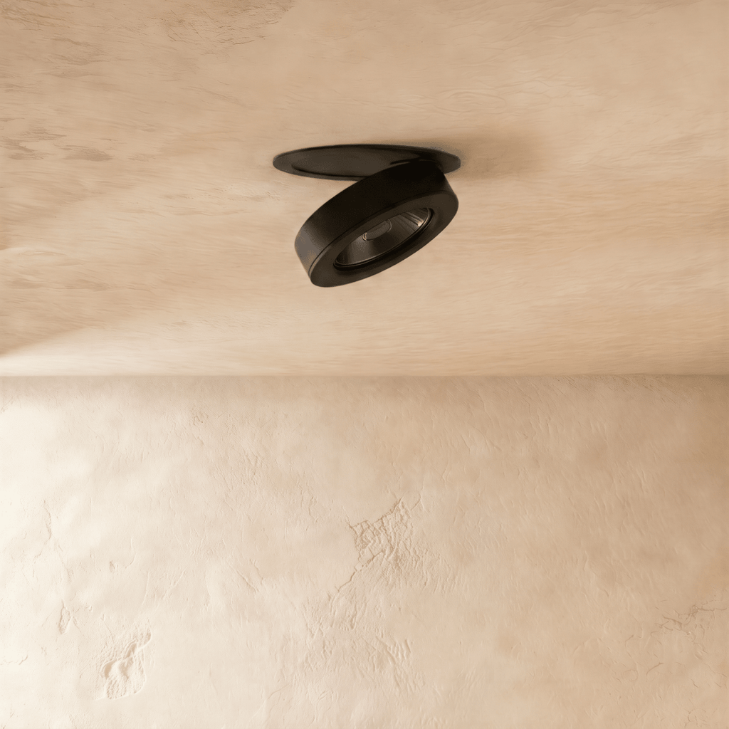 Clérachic recessed downlight in black, switched off and seen from the side, with the dark reflector cone set deep inside the head ring.