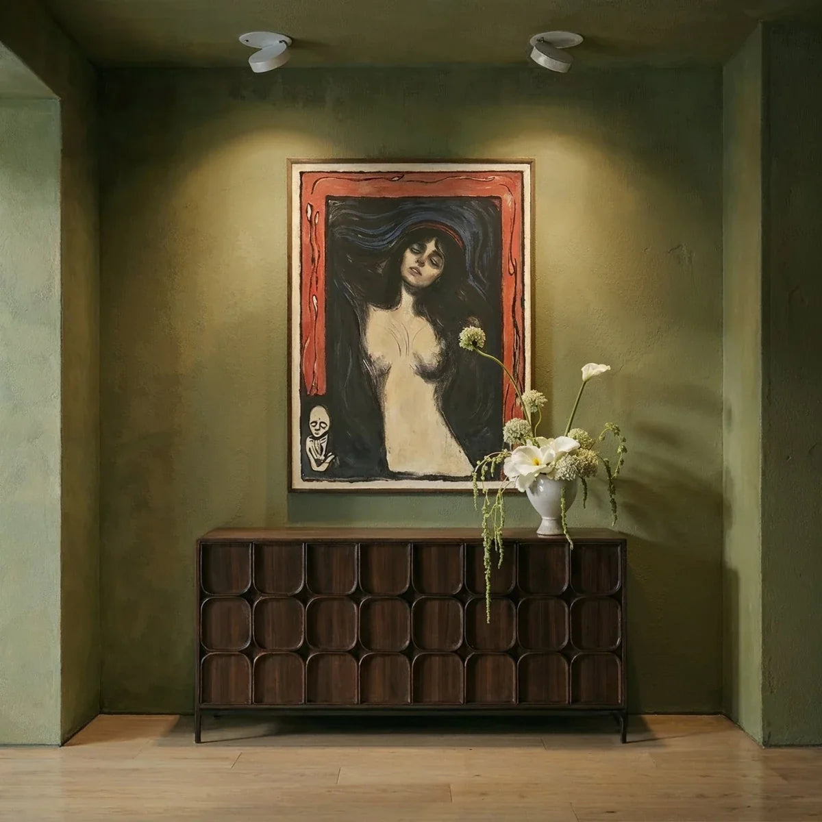 Clérachic recessed downlights in white, the same pair switched on to wash warm light across the framed portrait and the sideboard beneath it.