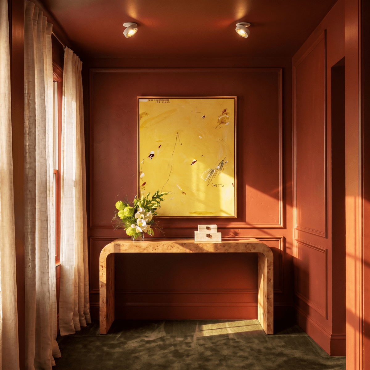 Clérachic recessed downlights in white, two units lighting a rust-red room with a burl wood console table and a framed yellow painting.