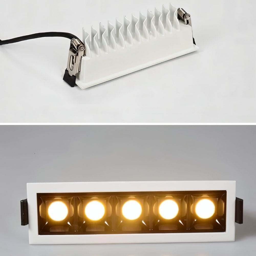 Clérachic five-head white downlight, shown from behind with finned heatsink and spring clips above the lit warm front face.