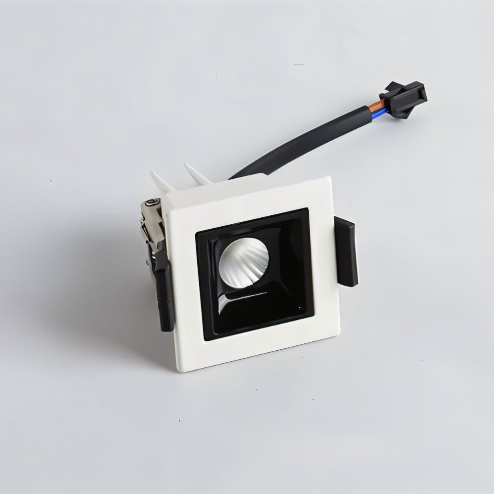 Clérachic single-head recessed square downlight in white with a black reflector, spring clips and a plug-in lead beside it.