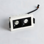 Clérachic two-head recessed downlight in a white trim with black reflectors, spring clips at the sides and a connector lead.