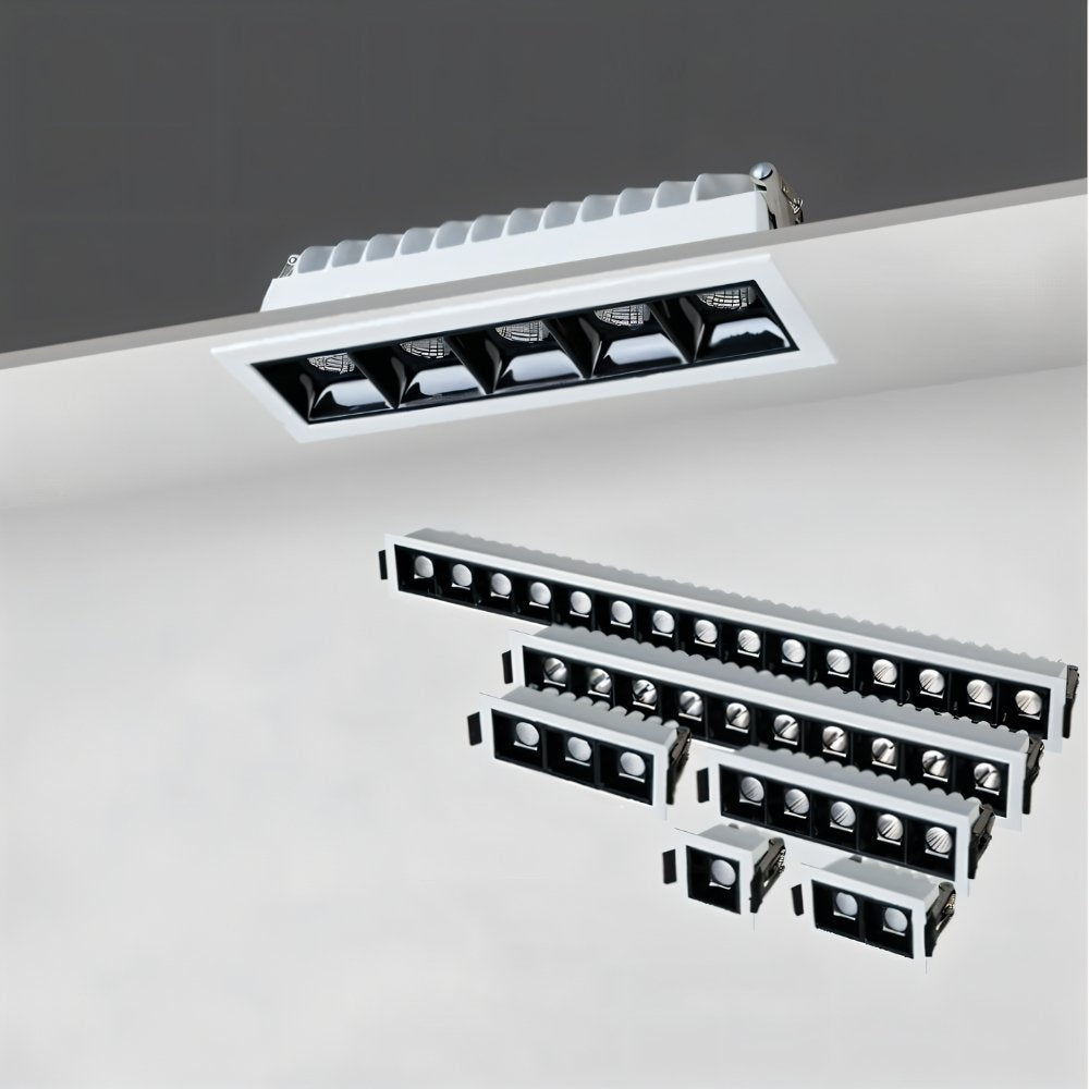 Clérachic recessed downlight range on a grey ceiling, one white five-head fitting above smaller one to fifteen-head fittings.