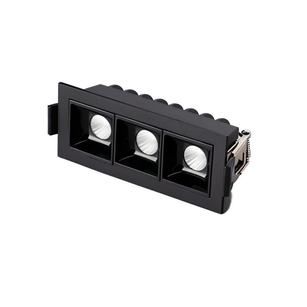 Clérachic three-head recessed linear downlight in black, with ribbed housing and square reflectors, on white.