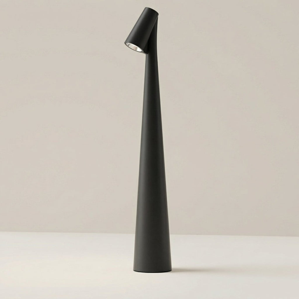Clérachic cone desk lamp in black, its tapered body angled to direct light from the top spot.