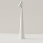 The Clérachic cone desk lamp in white, showing the slim tapered profile on a pale surface.