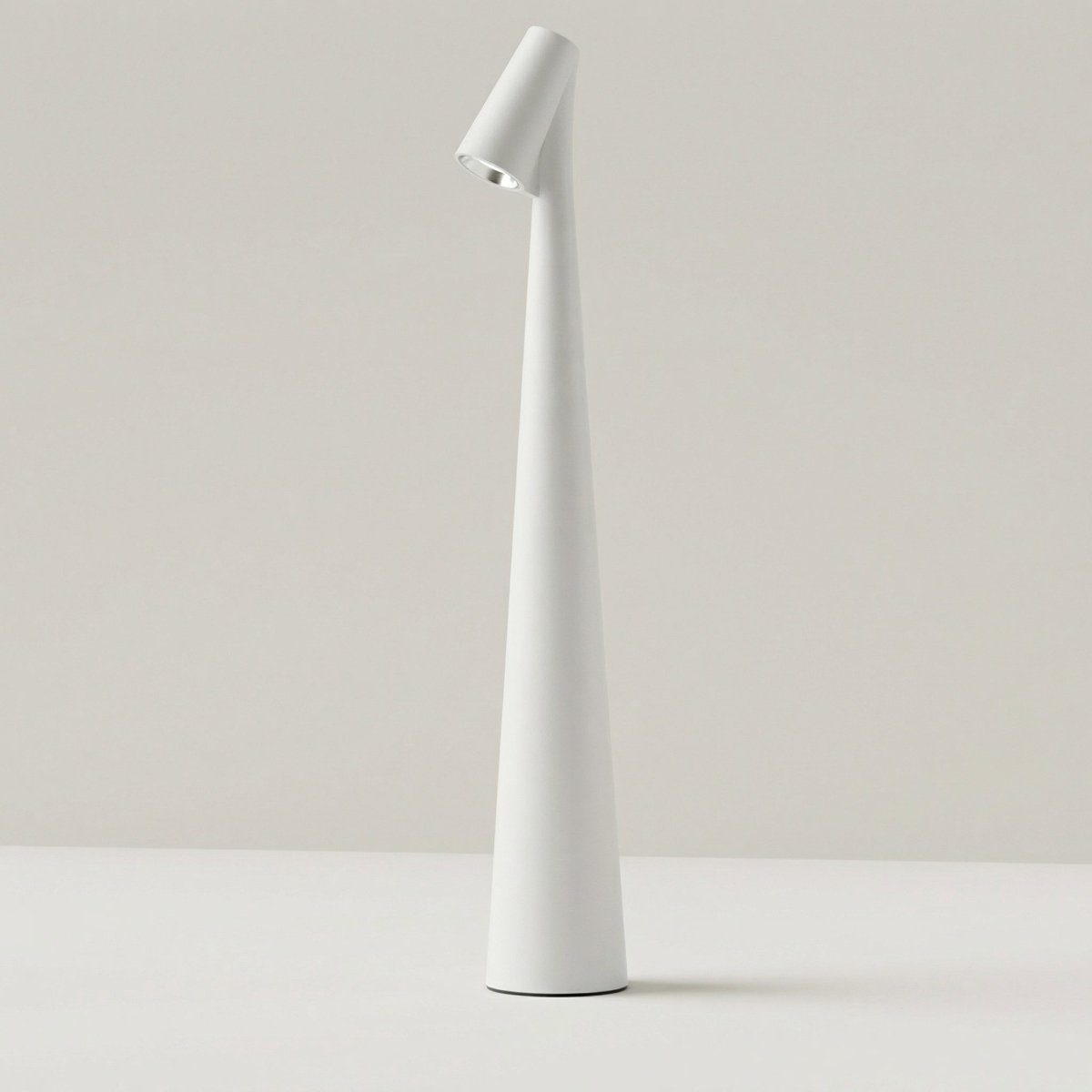 The Clérachic cone desk lamp in white, showing the slim tapered profile on a pale surface.