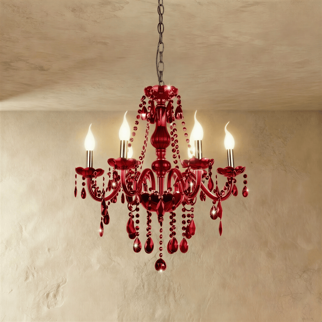 Clérachic deep red crystal chandelier with six candle-style lights, curved arms and faceted drops, hung on a chain.