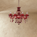 Clérachic red crystal chandelier with eight candle-style lights, sculpted floral cups and teardrop crystals on limewash.