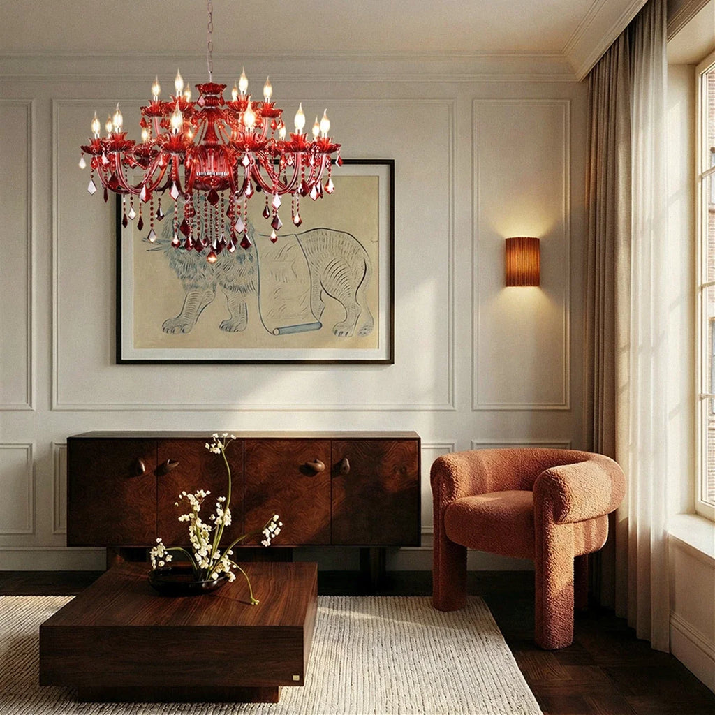 Clérachic large red crystal chandelier above a walnut coffee table and a rust boucle chair in a panelled living room.