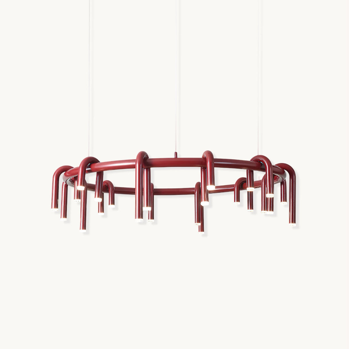 Red ring chandelier with arched tubular heads hanging below the frame, this Clérachic piece shown on a plain white backdrop.