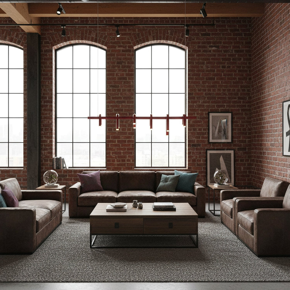 A slim row of red heads from a linear Clérachic chandelier, hung between arched windows above a leather seating area.
