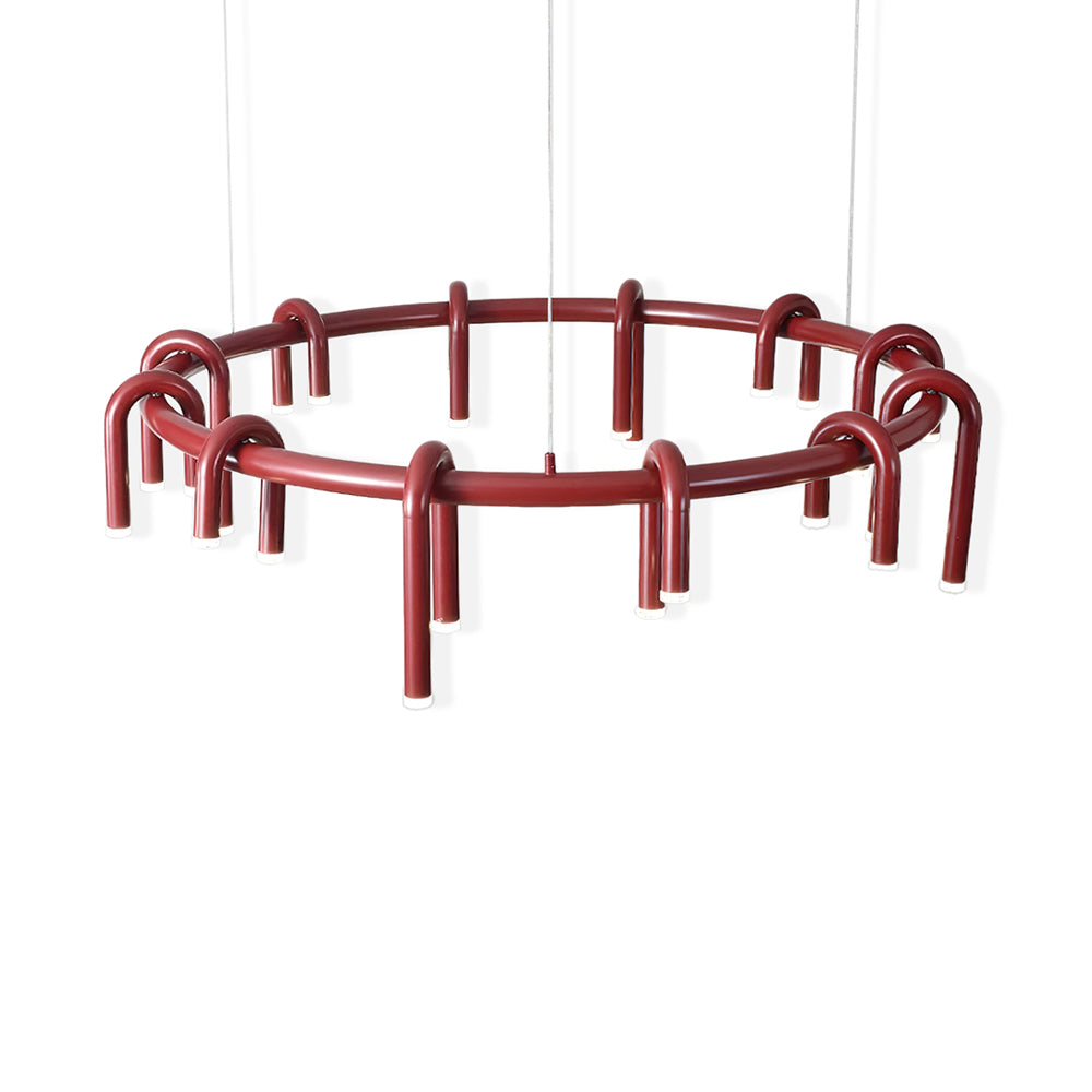 Red Clérachic ring chandelier on a plain white backdrop, showing its looped arches and the slim hanging wires.