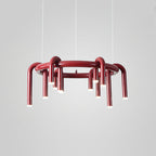 Red Clérachic ring chandelier on light grey, seen at a slight angle with its arched tubes hanging below the ring.