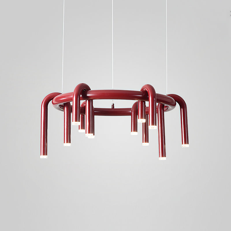 Red Clérachic ring chandelier on light grey, seen at a slight angle with its arched tubes hanging below the ring.