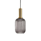 Tall smoke grey reeded glass shade from Clérachic on a gold stem, shown against a plain white backdrop.