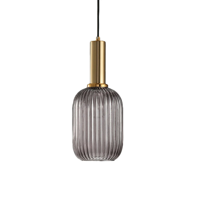Tall smoke grey reeded glass shade from Clérachic on a gold stem, shown against a plain white backdrop.