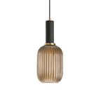 Tall amber reeded glass shade from Clérachic with a black fitting, shown against a plain white backdrop.