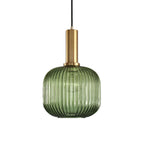 Rounded green reeded glass shade from Clérachic on a gold stem, shown against a plain white backdrop.