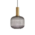 Rounded smoke grey reeded glass shade from Clérachic on a gold stem, shown against a plain white backdrop.