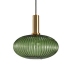 Flat, wide green reeded glass shade from Clérachic on a gold stem, shown against a plain white backdrop.