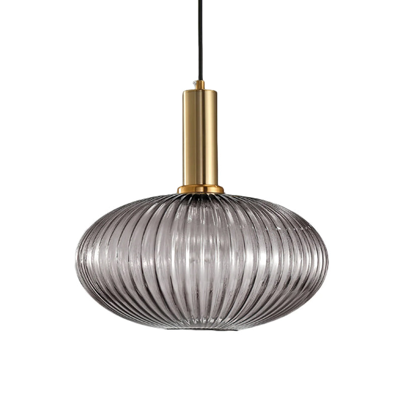 Flat, wide smoke grey reeded glass shade from Clérachic on a gold stem, shown against a plain white backdrop.