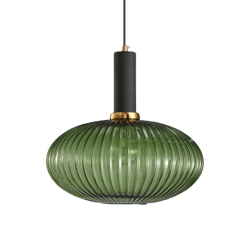 Flat, wide green reeded glass shade from Clérachic with a black fitting, shown against a plain white backdrop.