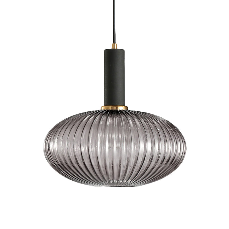 Flat, wide smoke grey reeded glass shade from Clérachic with a black fitting, shown against a plain white backdrop.