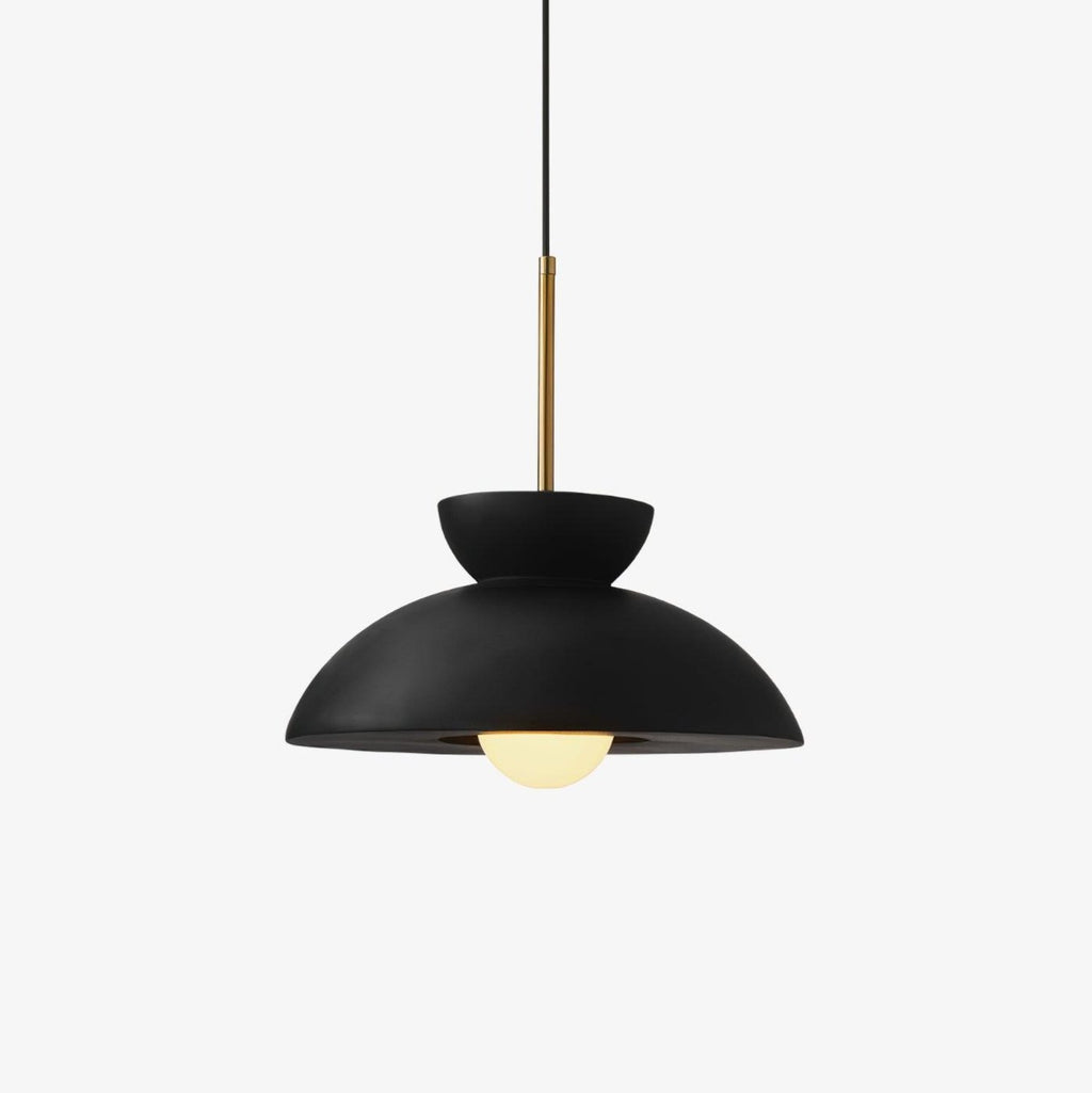 Black dome shade with a small upturned bowl above it and a brass stem, this Clérachic pendant on a plain white backdrop.