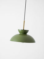 Tilted view of the green Clérachic pendant, showing the brass stem, the upturned bowl and the matte dome.
