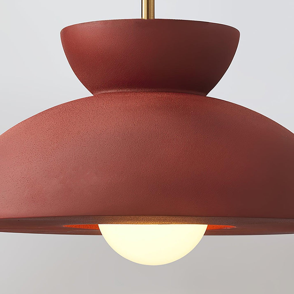 Close view of the textured red dome and round opal bulb on this Clérachic pendant.