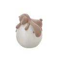 This Clérachic rabbit lamp, a flocked rabbit lying over a pale textured globe, cut out on a plain white background.