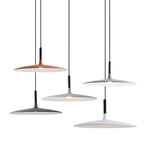 Six Clérachic pendants in orange, grey, black and white hung at different heights against a plain white backdrop.
