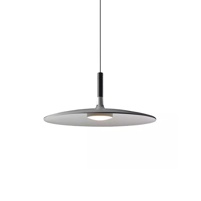 A grey Clérachic pendant light on white, with a slim black stem joined to a flat disc and round light below.